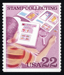 Boy Examining Stamp Collection United States Postage Stamp | Stamp Collecting