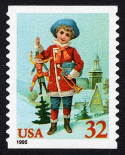Child Holding Jumping Jack - Horizontal Imperforate United States Postage Stamp | Christmas 1995